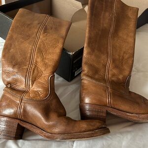 Frye leather boots. Boots are knee high with pull tabs inside and block heels.